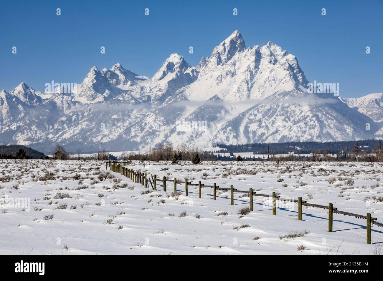 WY05075-00.....WYOMING - View of the Teton Range in winter from Cunningham Cabin Historic Site in Grand Teton National Park. Stock Photo