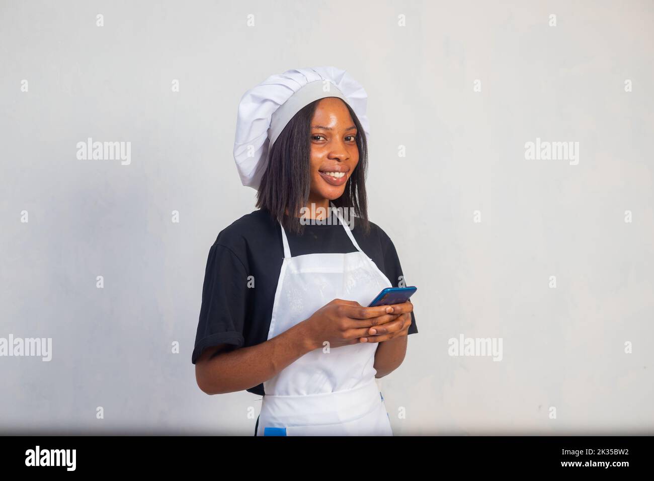 Girl in a black apron hi-res stock photography and images - Alamy