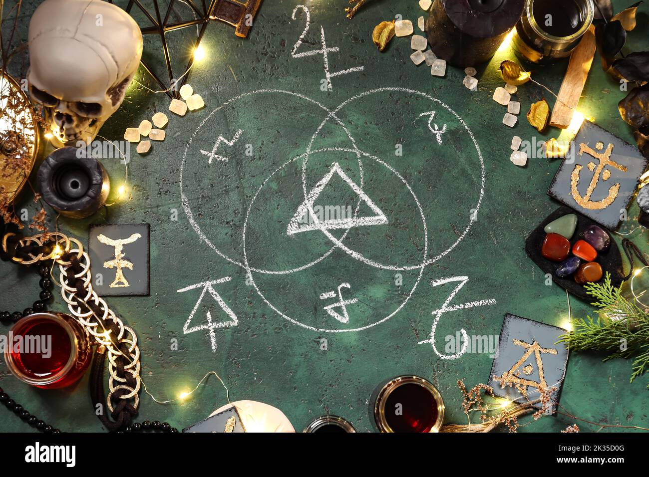Frame made of magic attributes for ritual and symbols on color ...