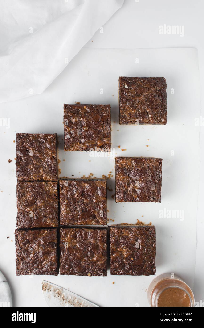 Flat lay of brownies, brownies that have been cut into squares, caramel
