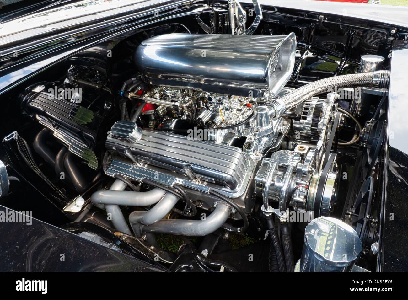 Muscle Car Engine with dual carburetors, headers and lots of shiny