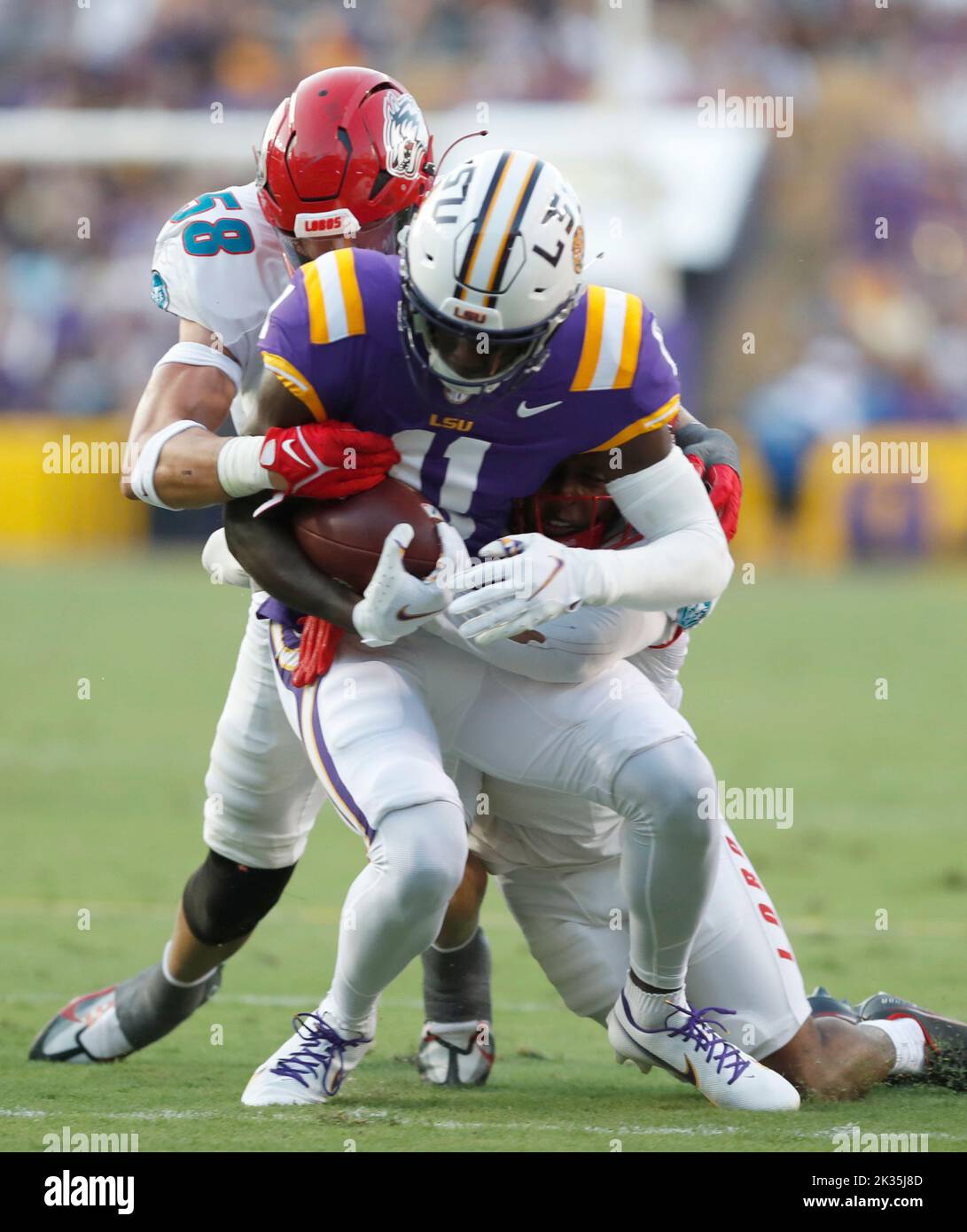 New Mexico Lobos linebacker Cody Moon (58) tries to take down LSU wide