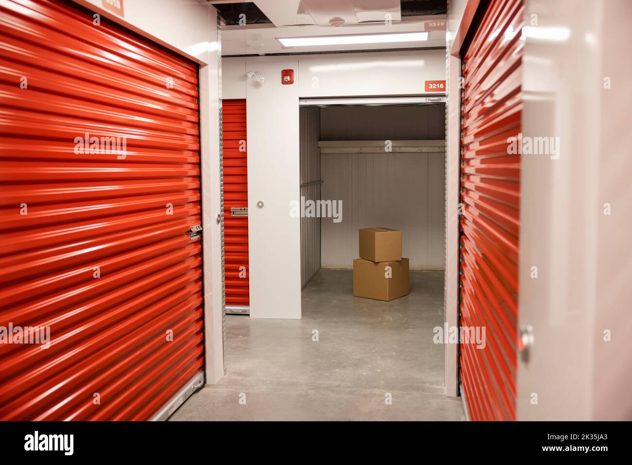 Cardboard boxes in open storage facility locker Stock Photo Alamy