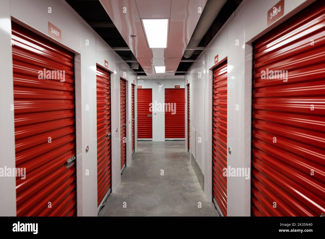 Storage facility interior corridor with rows of lockers Stock Photo Alamy