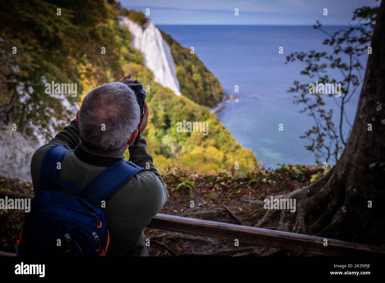 Sassnitz, Germany. 23rd Sep, 2022. A man takes a photo of the chalk