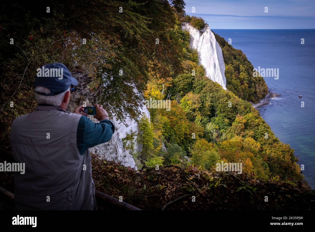 Sassnitz, Germany. 23rd Sep, 2022. A man takes a photo of the chalk