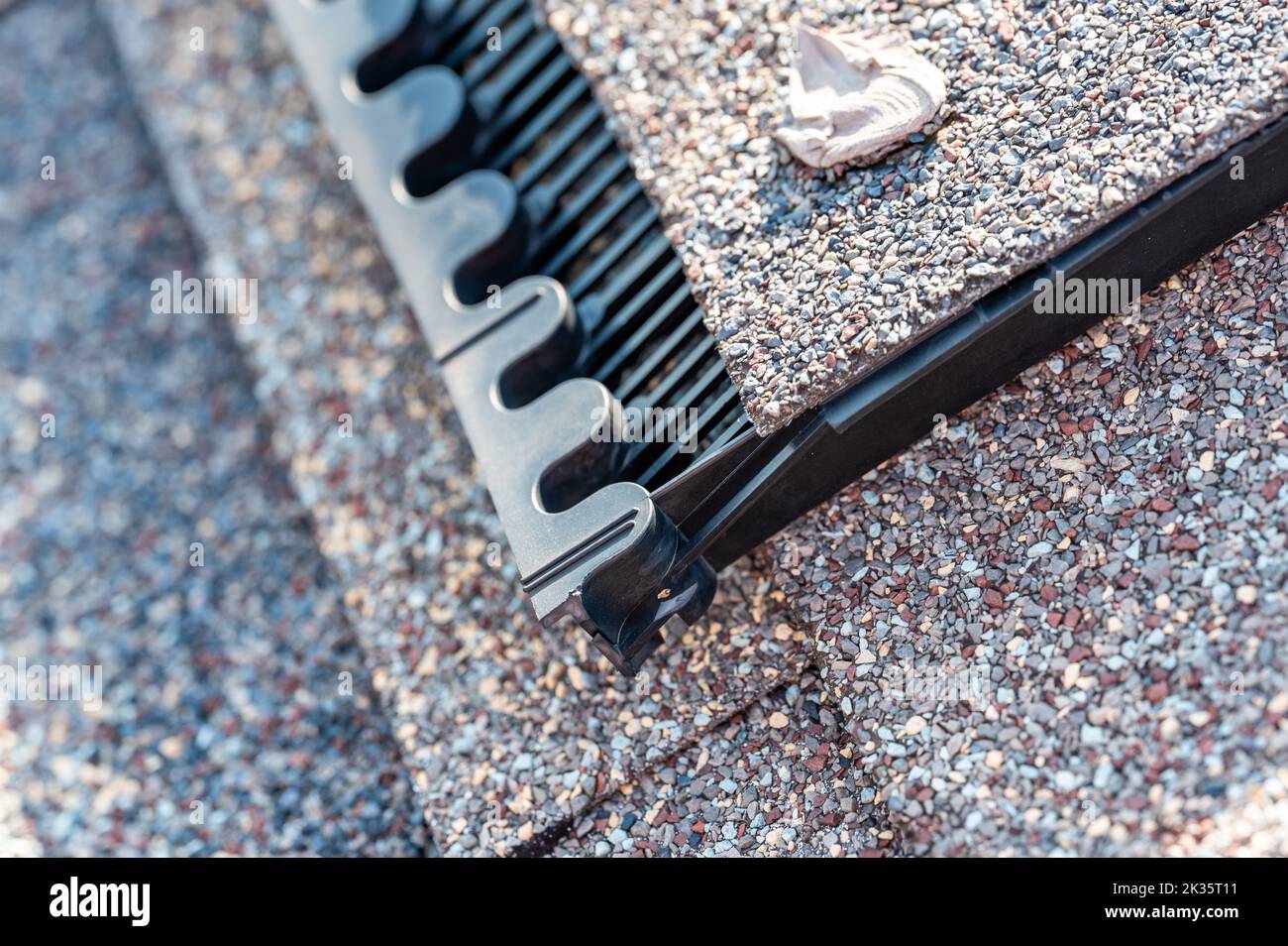 Ridge cap vent installed on a shingle roof for passive attic