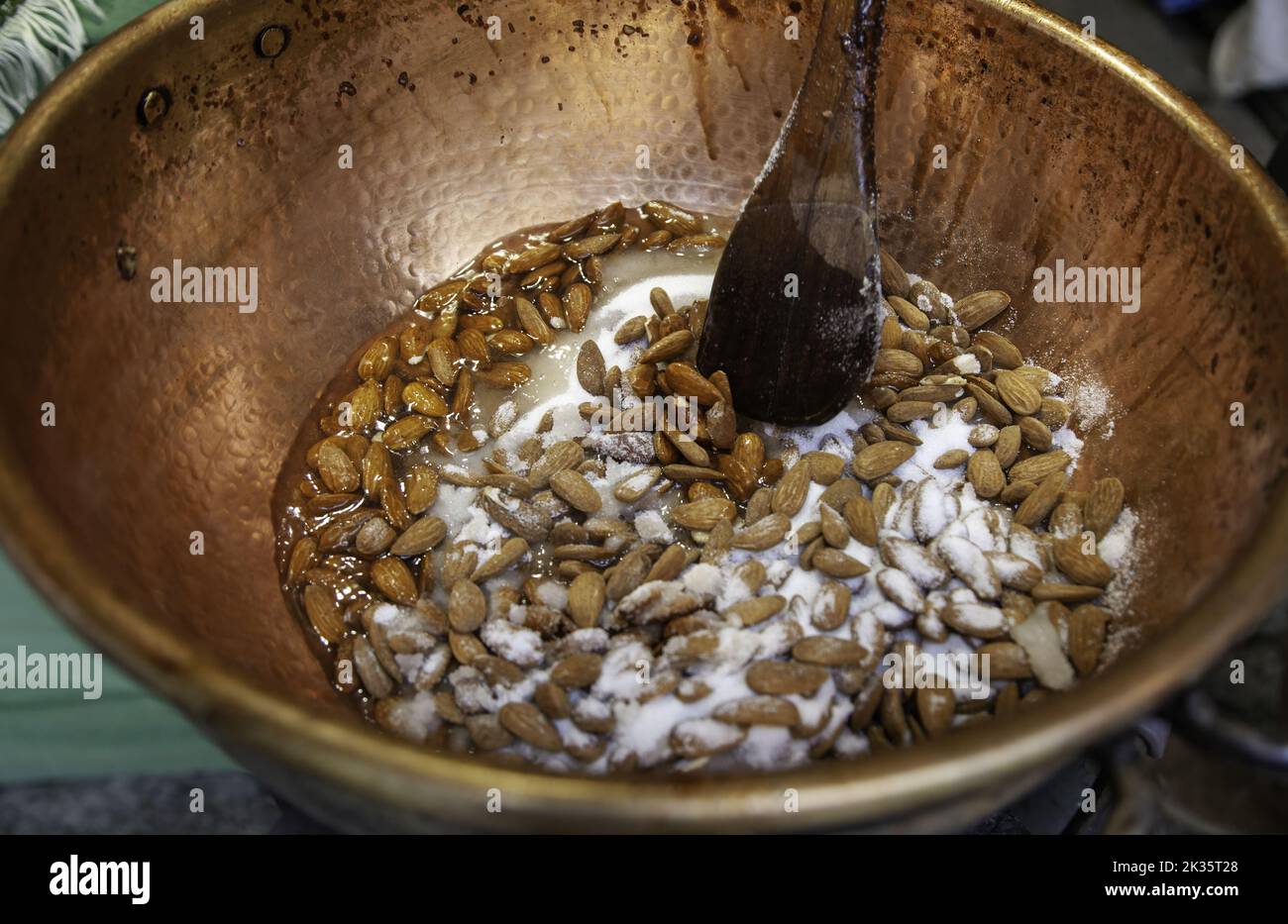 Detail of manufacturing of candied almonds, sugar Stock Photo
