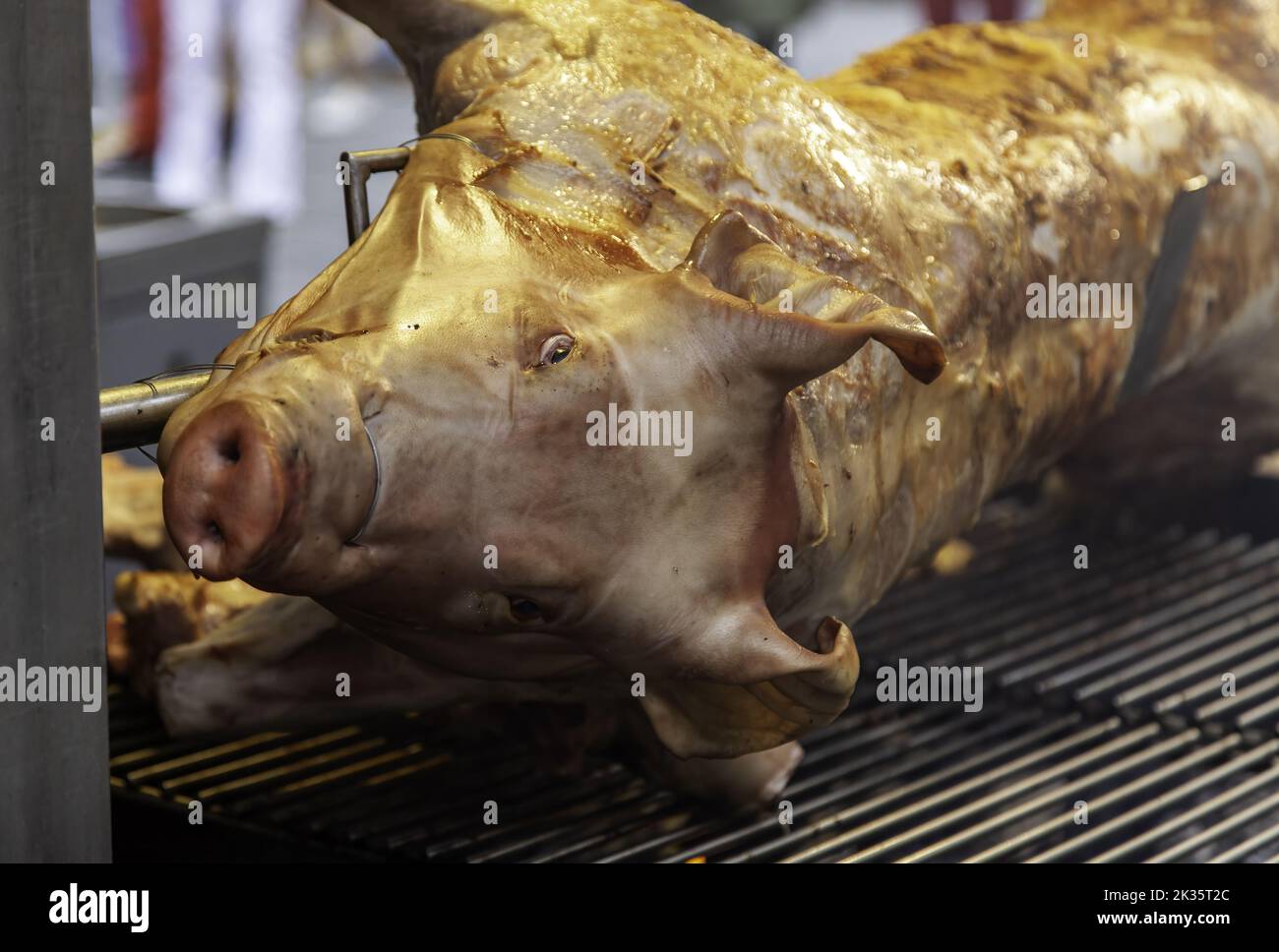 Detail of pig roasted on a grill, celebration and party Stock Photo
