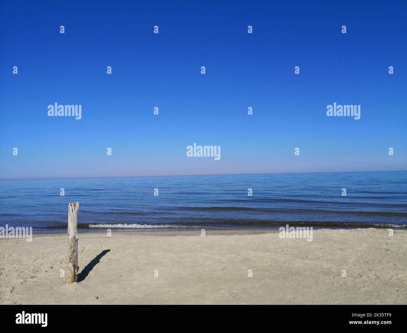 Empty Baltic sea beach and calm sea, Curonian spit, Lithuania Stock Photo