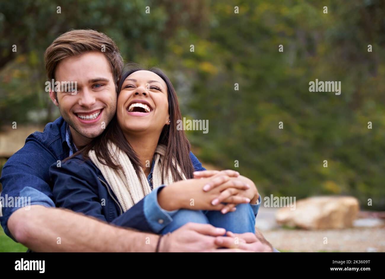I just love your sense of humour. a good-looking young couple enjoying an affectionate moment outdoors. Stock Photo