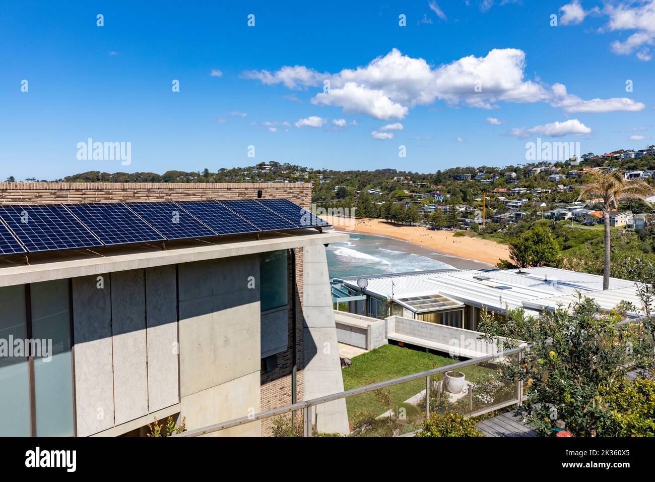 Solar panels PV fitted to a luxury beach house in Whale Beach suburb of Sydney,NSW,Australia, with views of the ocean and beach Stock Photo
