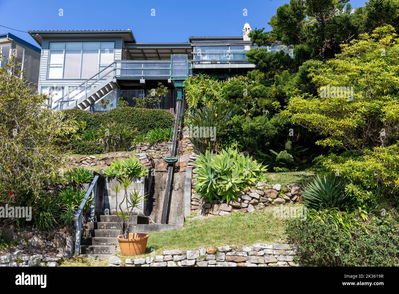 Whale Beach suburb in Sydney, external travelator lift to give access to the house at the top of the hill,Sydney,NSW,Australia Stock Photo