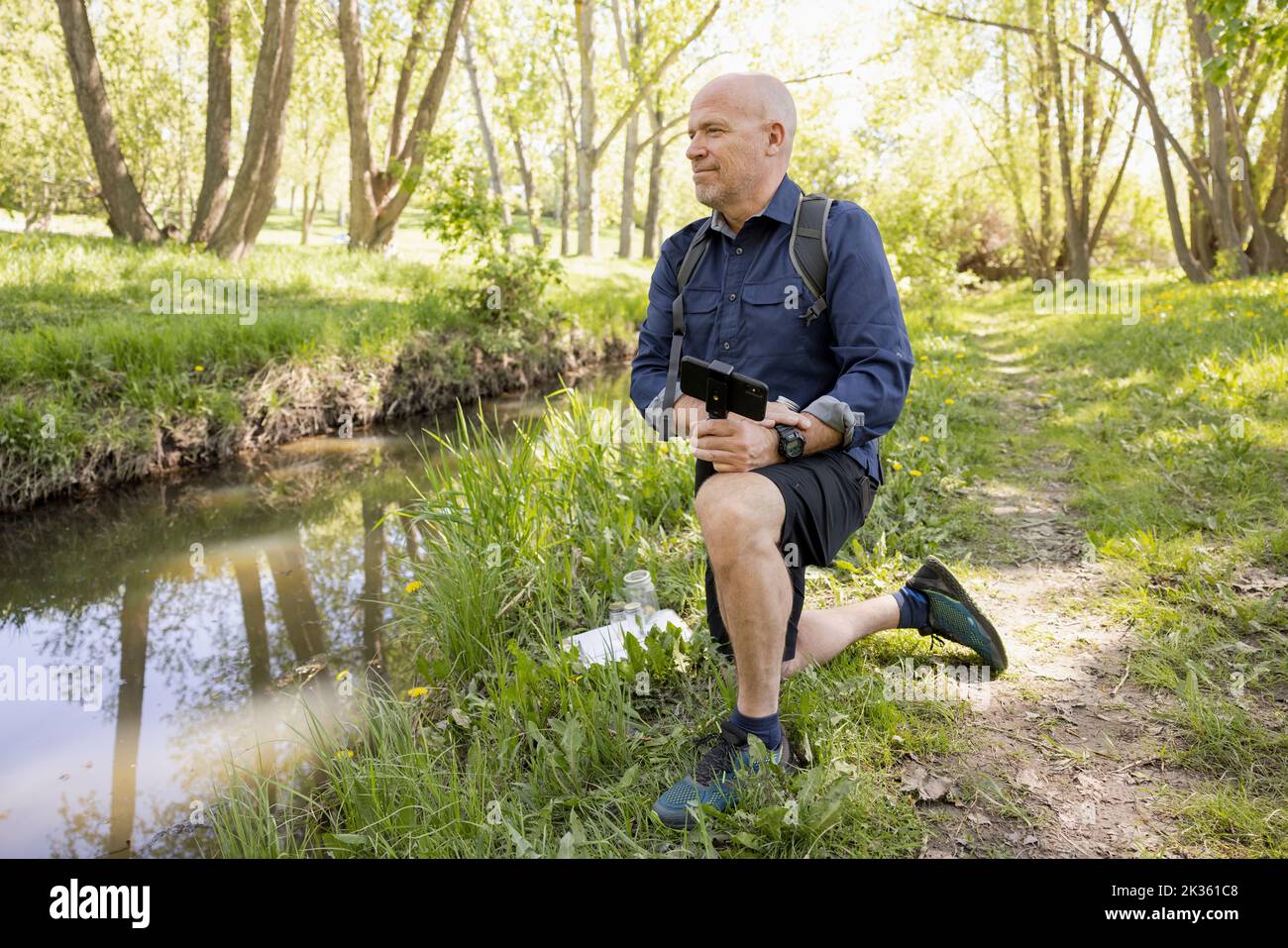 Kneeling man hi-res stock photography and images - Alamy
