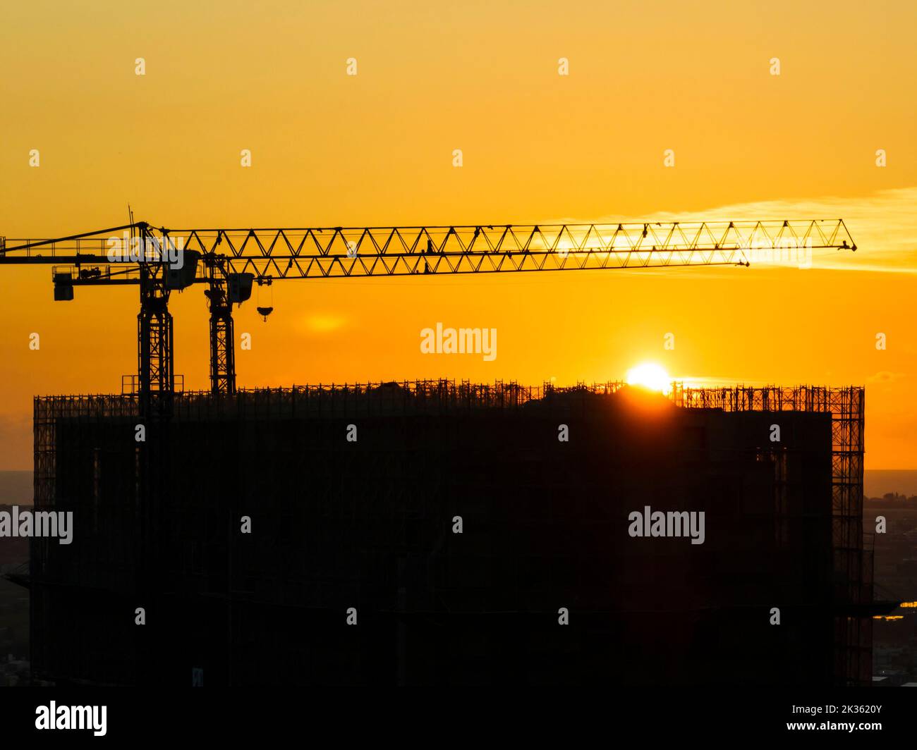 Silhouette of building site background, construction site at sunset Stock Photo