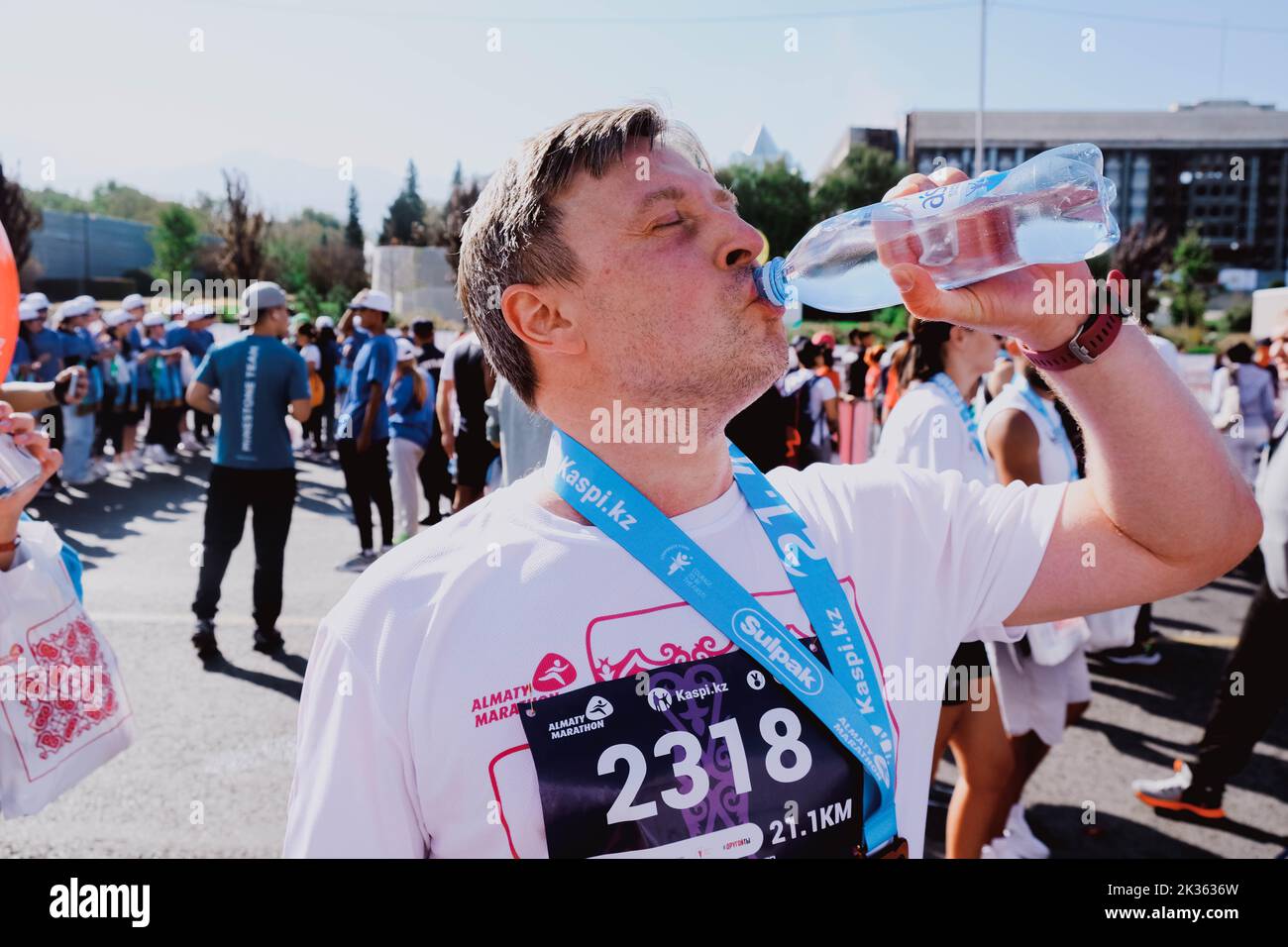 Kazakhstan, AlmatySeptember 25, 2022 Almaty marathon. Man drinking