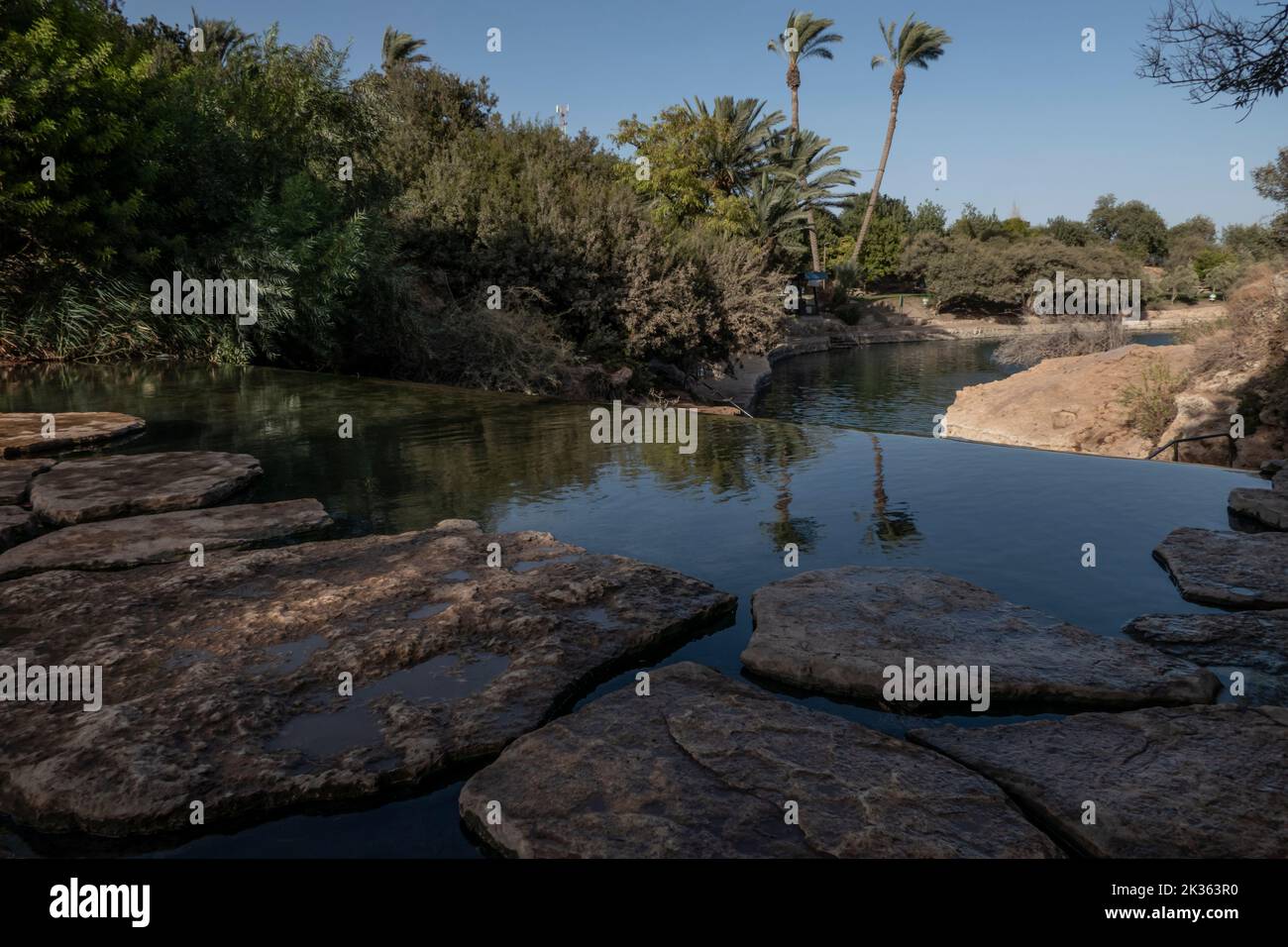 View of a natural spring water pool of Amal stream which crosses Gan HaShlosha National Park also known by its Arabic name Sakhne in Israel Stock Photo