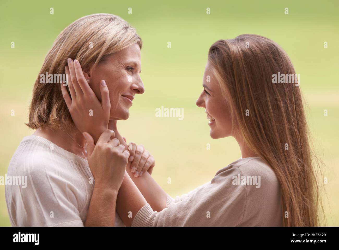 She appreciates her mother so much. A daughter being affectionate towards her mother. Stock Photo