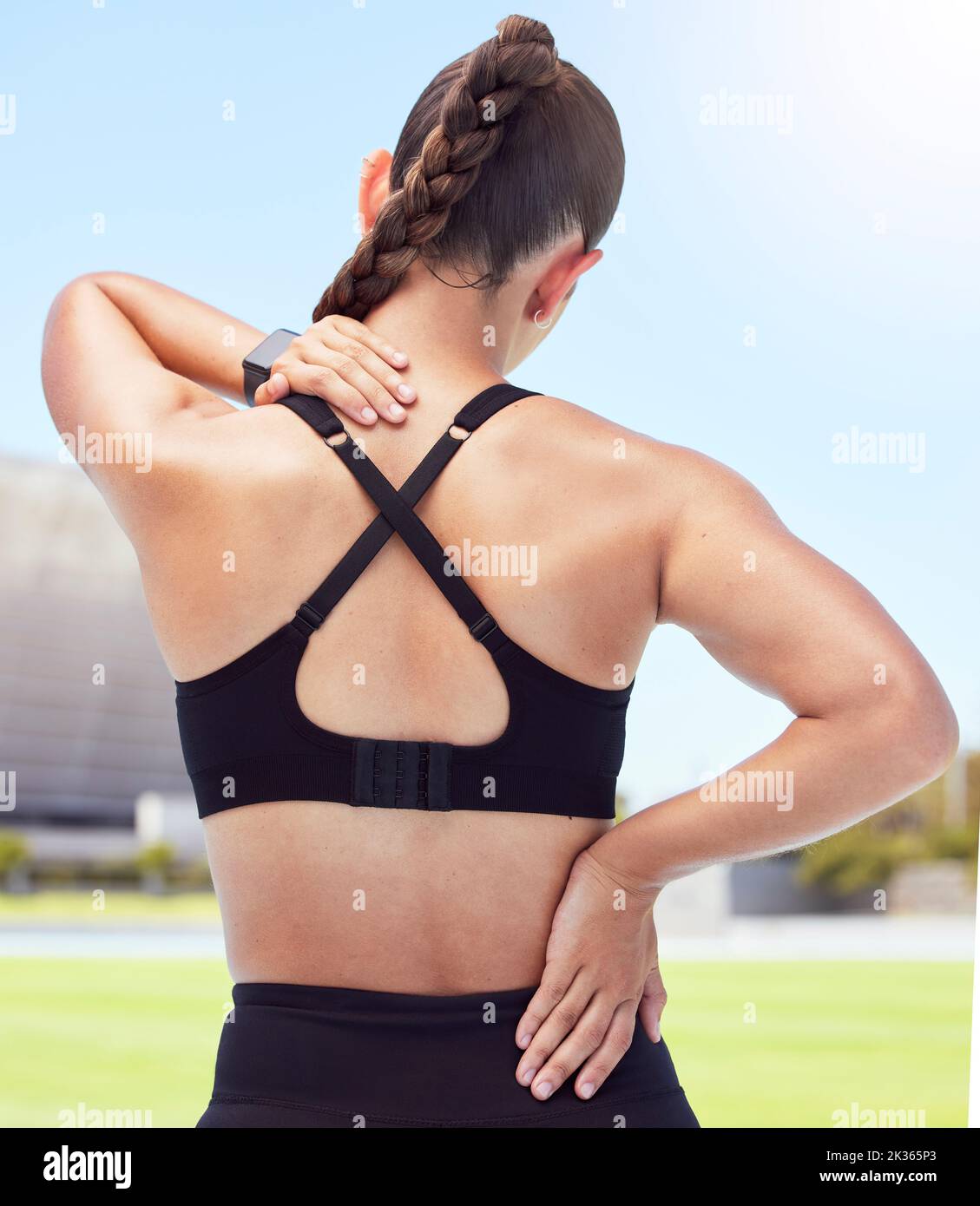 Fitness woman back pain, spine injury and neck problems at sports training stadium outdoors