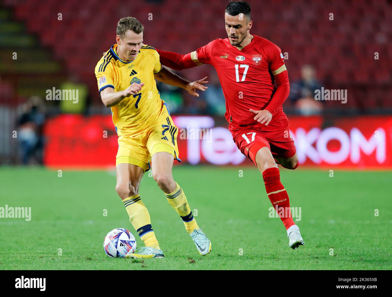 Belgrade, Serbia. 24th Sep, 2022. Sweden's Viktor Claesson (L) vies with Serbia's Filip Kostic during the League B Group 4 match at the 2022 UEFA Nations League in Belgrade, Serbia, Sept. 24, 2022. Credit: Predrag Milosavljevic/Xinhua/Alamy Live News Stock Photo