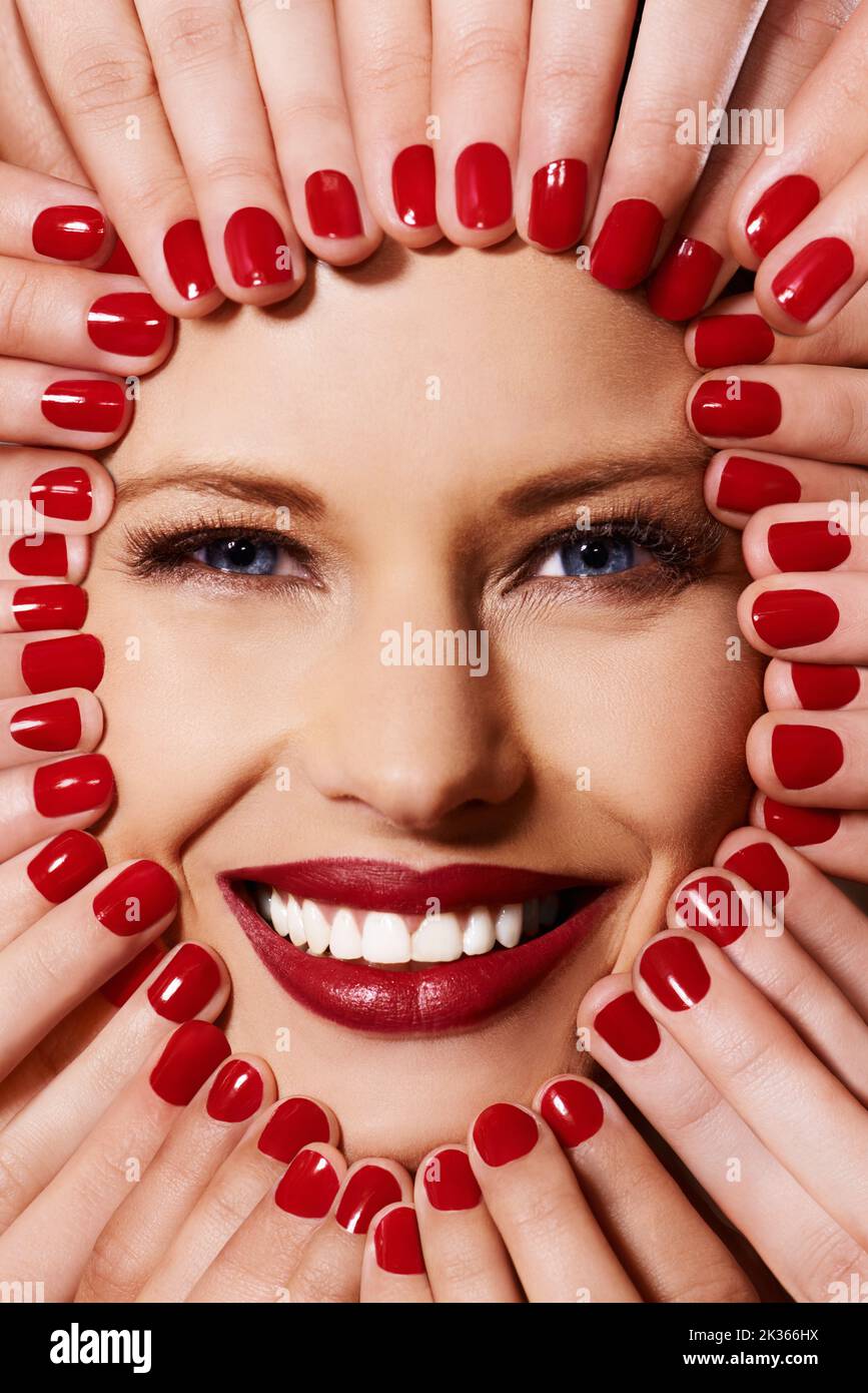The colour is too much. A young woman with multiple sets of hands on her face. Stock Photo