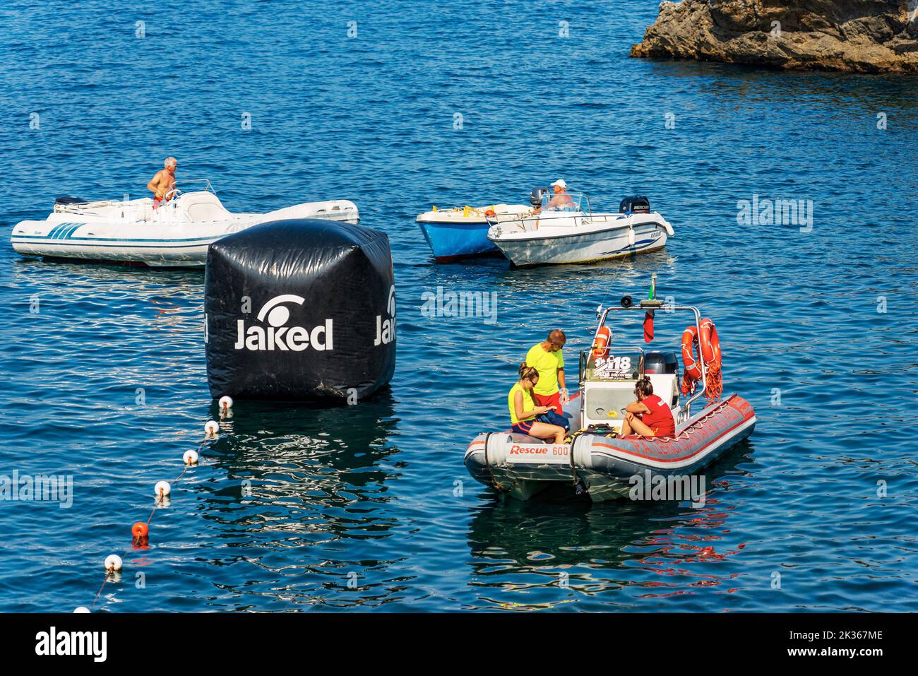 Water ambulance, small motor boat for emergency first aid with people on board in the Mediterranean Sea, Tellaro, Gulf of La Spezia, Liguria, Italy. Stock Photo