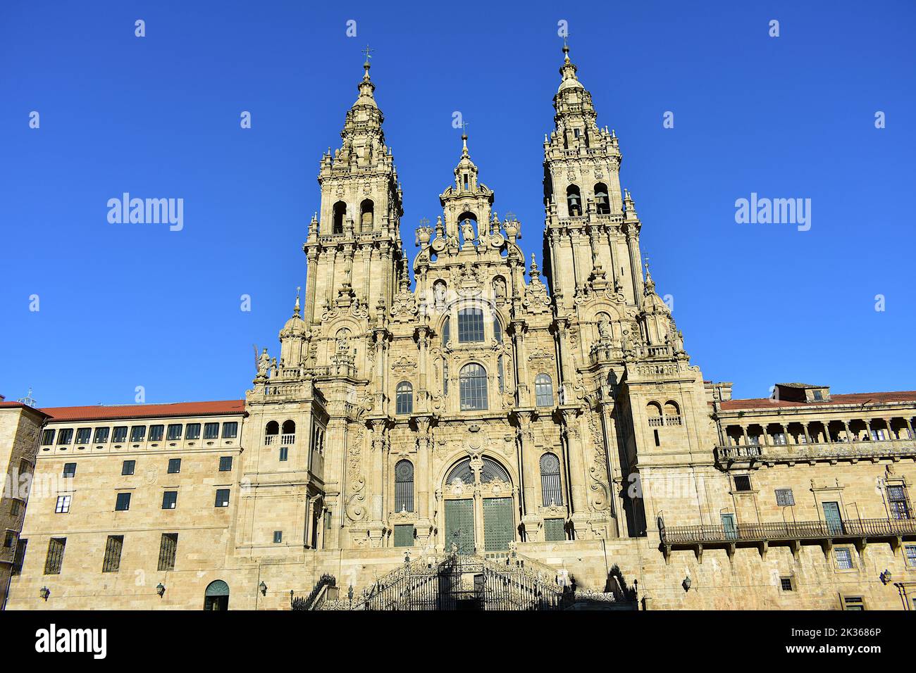 Cathedral, baroque facade and towers from Praza do Obradoiro with blue sky. Santiago de Compostela, Spain. Stock Photo