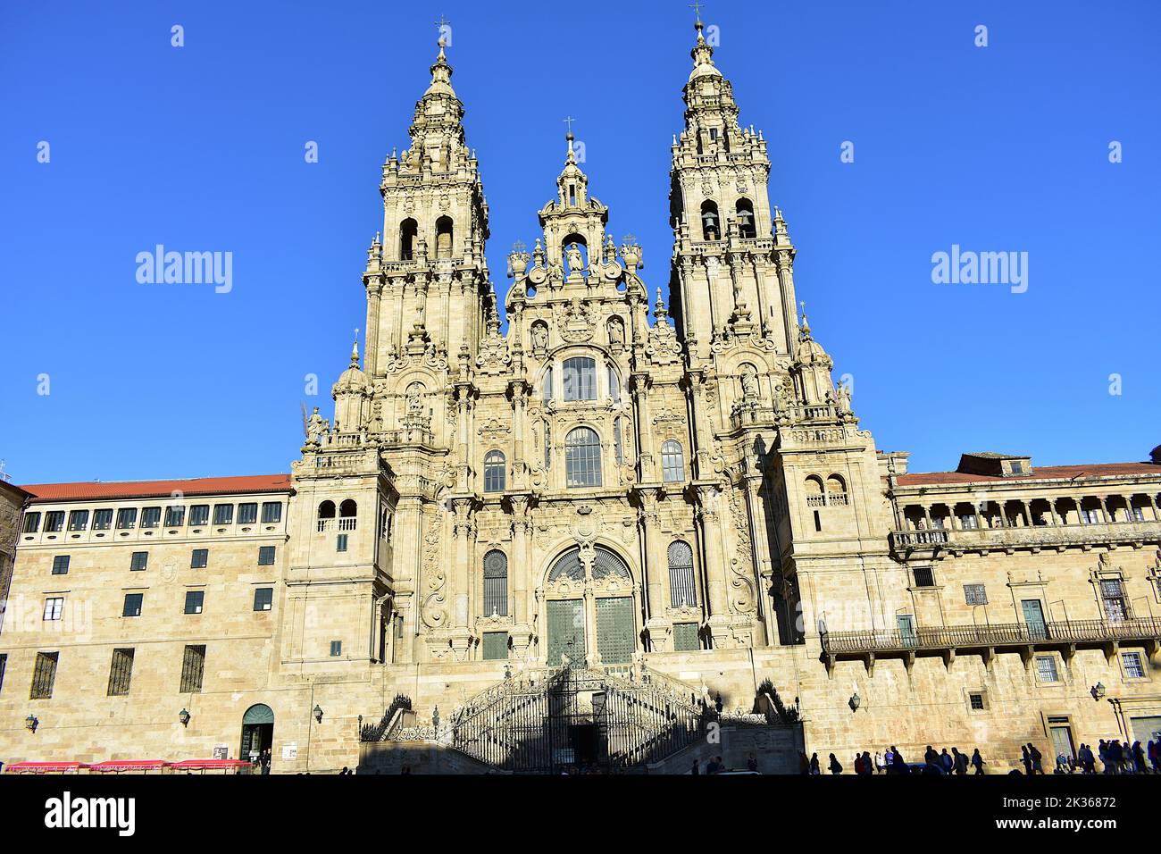 Cathedral, baroque facade and towers from Praza do Obradoiro with blue sky. Santiago de Compostela, Spain. Stock Photo