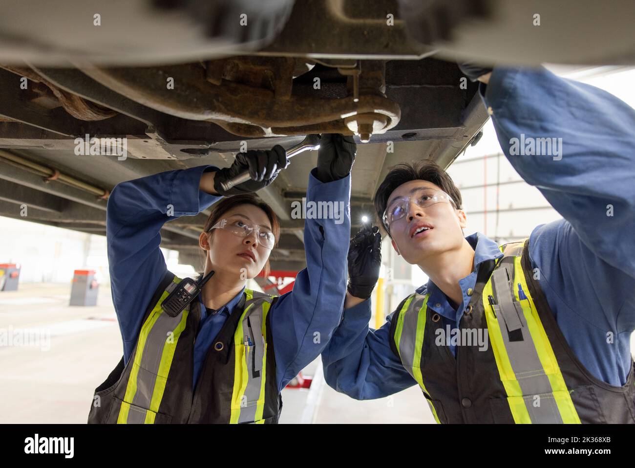 Mechanic working under bus hires stock photography and images Alamy