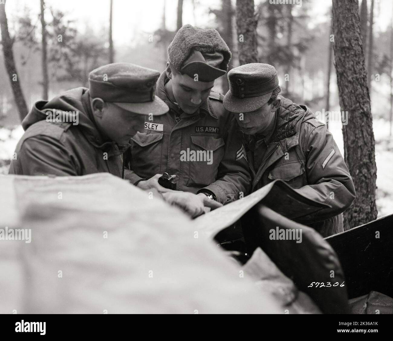 Midway During Maneuver Reconnaissance Mission, 32nd Armor Scout, Sgt Elvis Presley, Coordinates with German Bundeswehr Soldiers on Location and Direction to Move Stock Photo