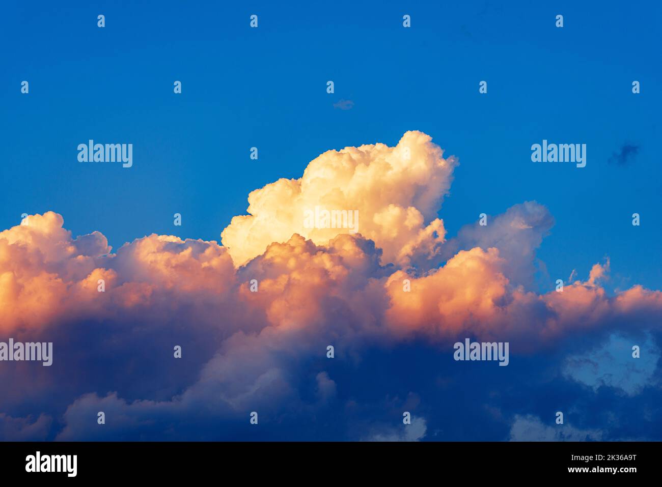 Photography of beautiful storm clouds, cumulus clouds or cumulonimbus at sunset. Full frame, sky only. Stock Photo