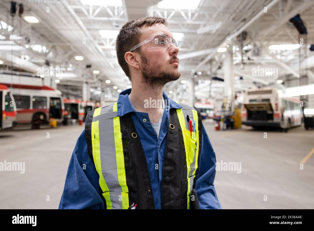Portrait male maintenance facility worker looking away Stock Photo Alamy