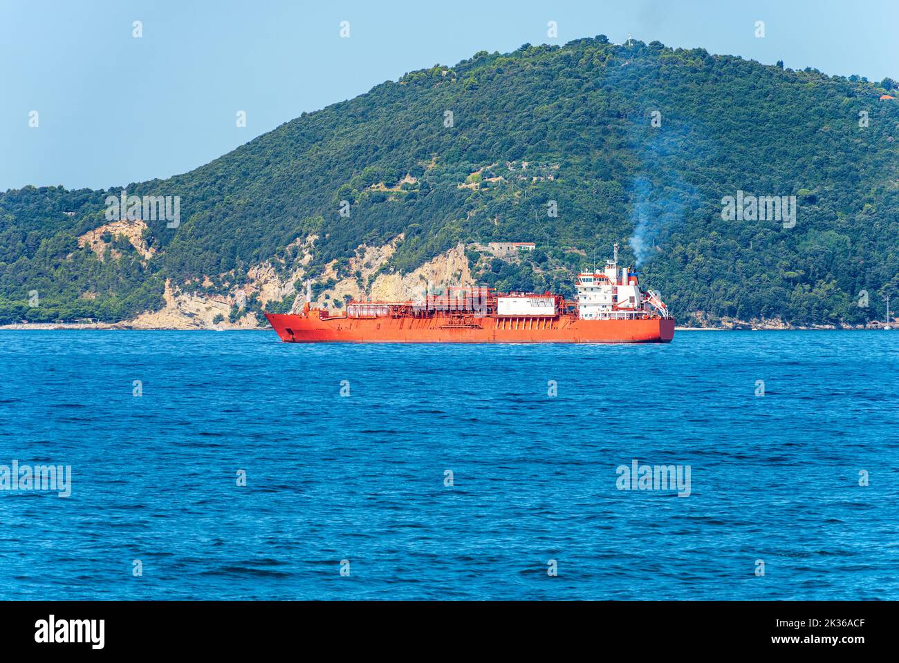 Liquefied natural gas tanker ship in the Mediterranean Sea, Gulf of La Spezia, Liguria, Italy, Europe. On background the Palmaria island, Porto Venere Stock Photo