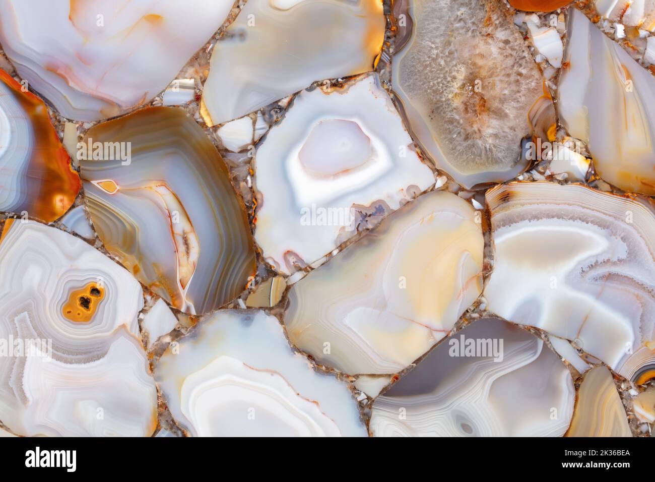 Natural agates, semi precious stones in light color as part of unique personal interior design or other art work. Stock Photo
