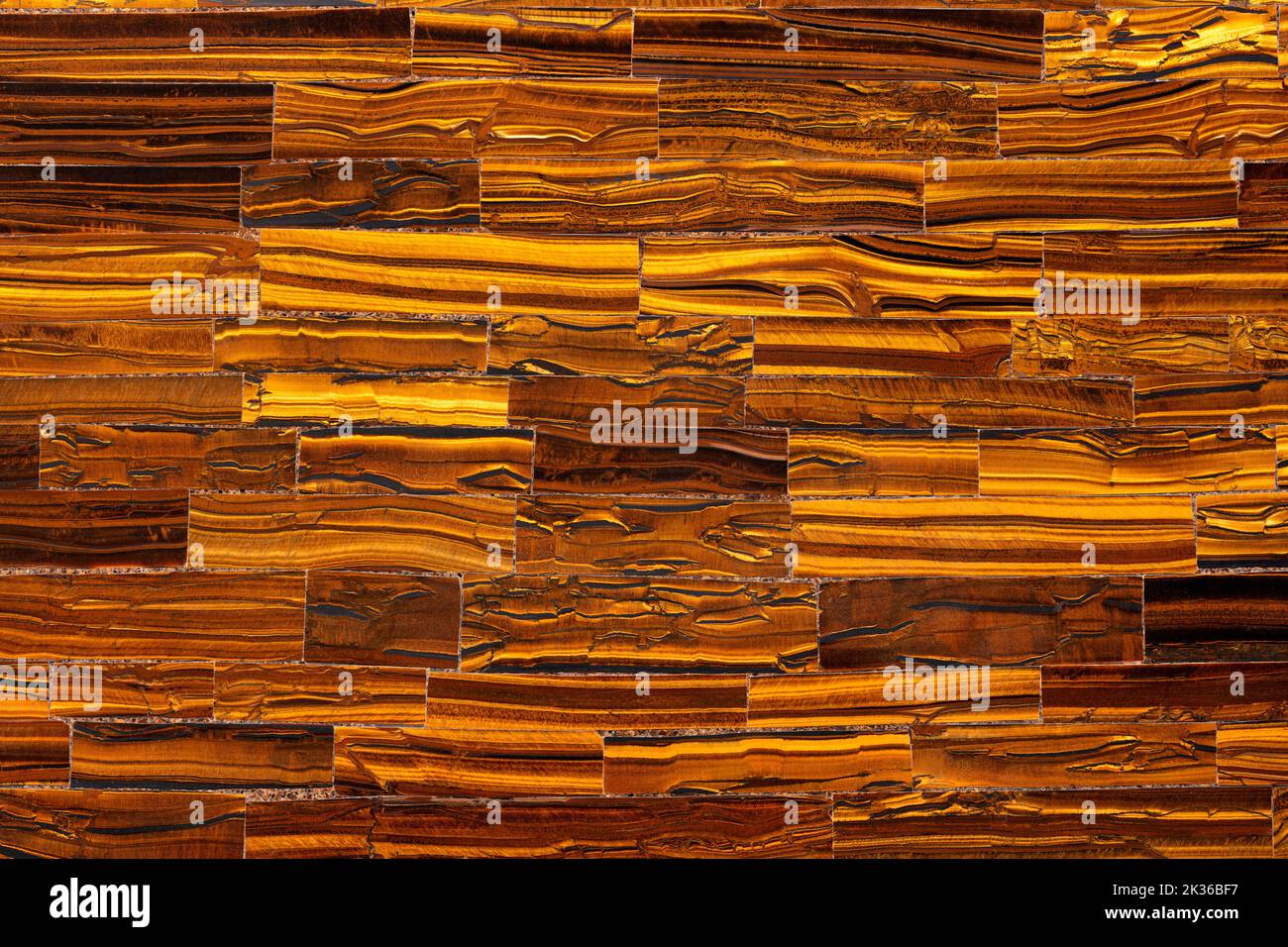 Tiger Eye Golden. Semi precious brown mineral pattern. Polished semiprecious stone for ceramic wall and floor digital tiles. Material for unique Stock Photo