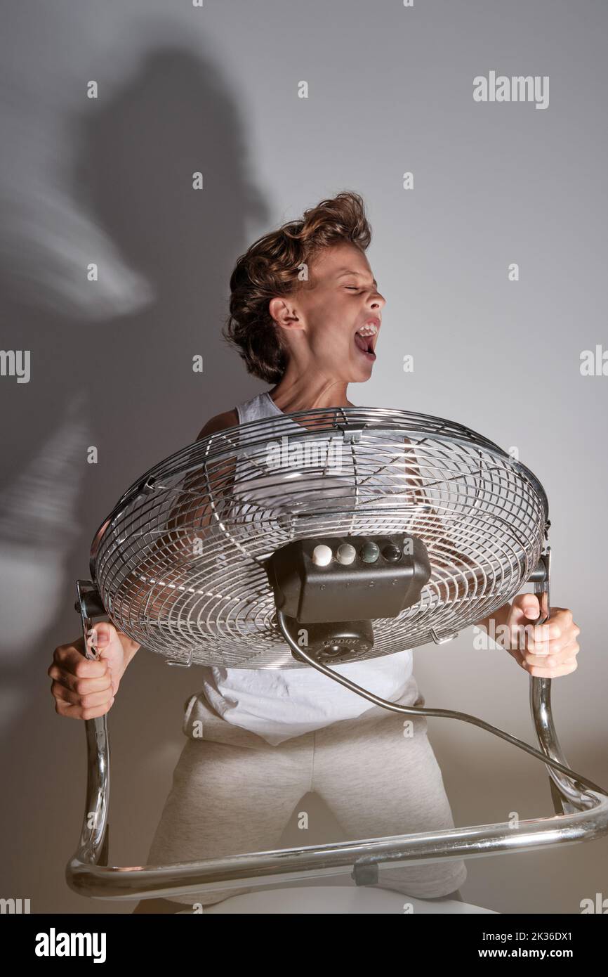 Fan blowing boy hires stock photography and images Alamy