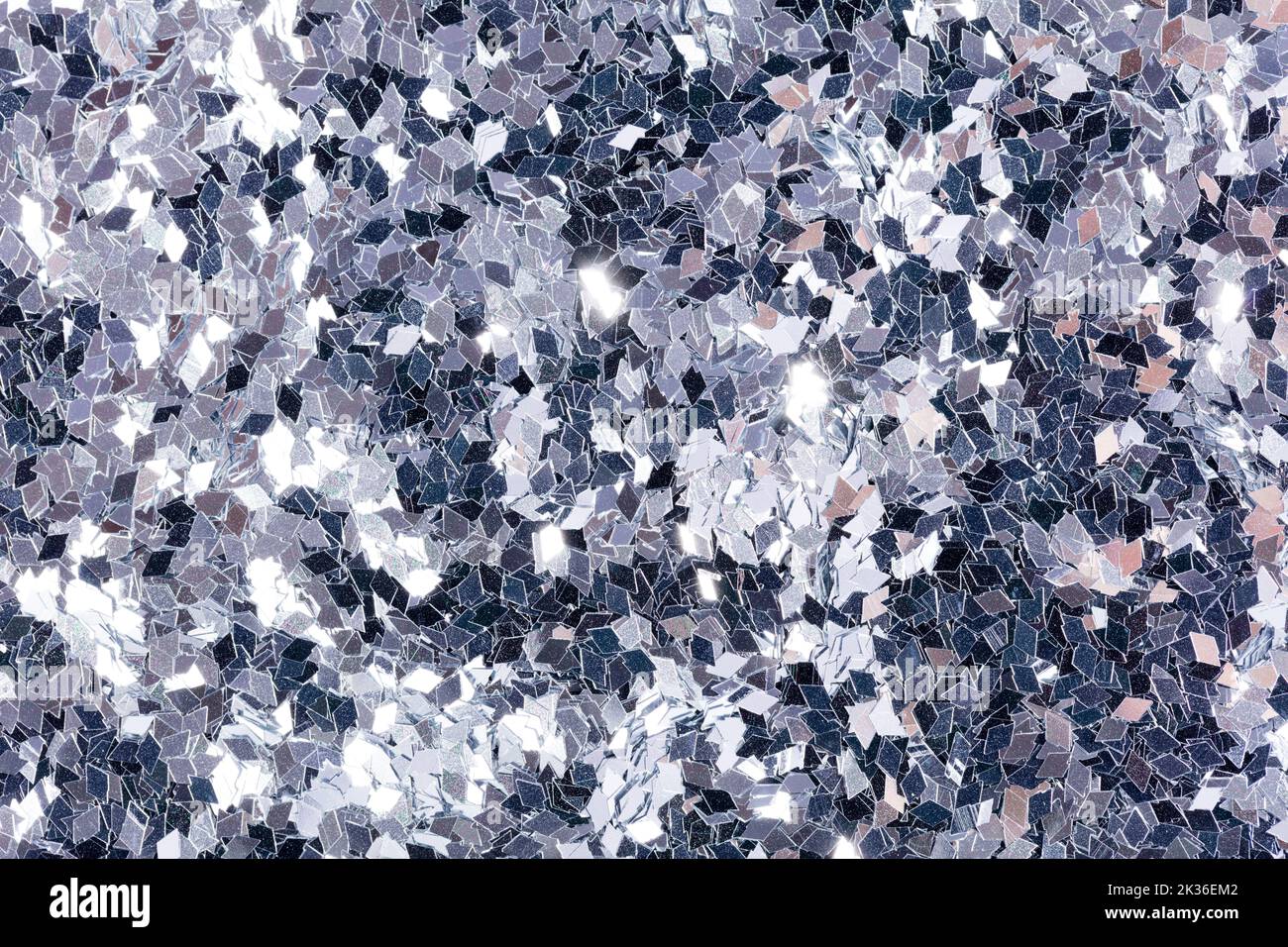 New grey holographic glitter background, for your new elegant texture for Christmas design. Holiday abstract glitter with blinking lights. Fabric sequ Stock Photo