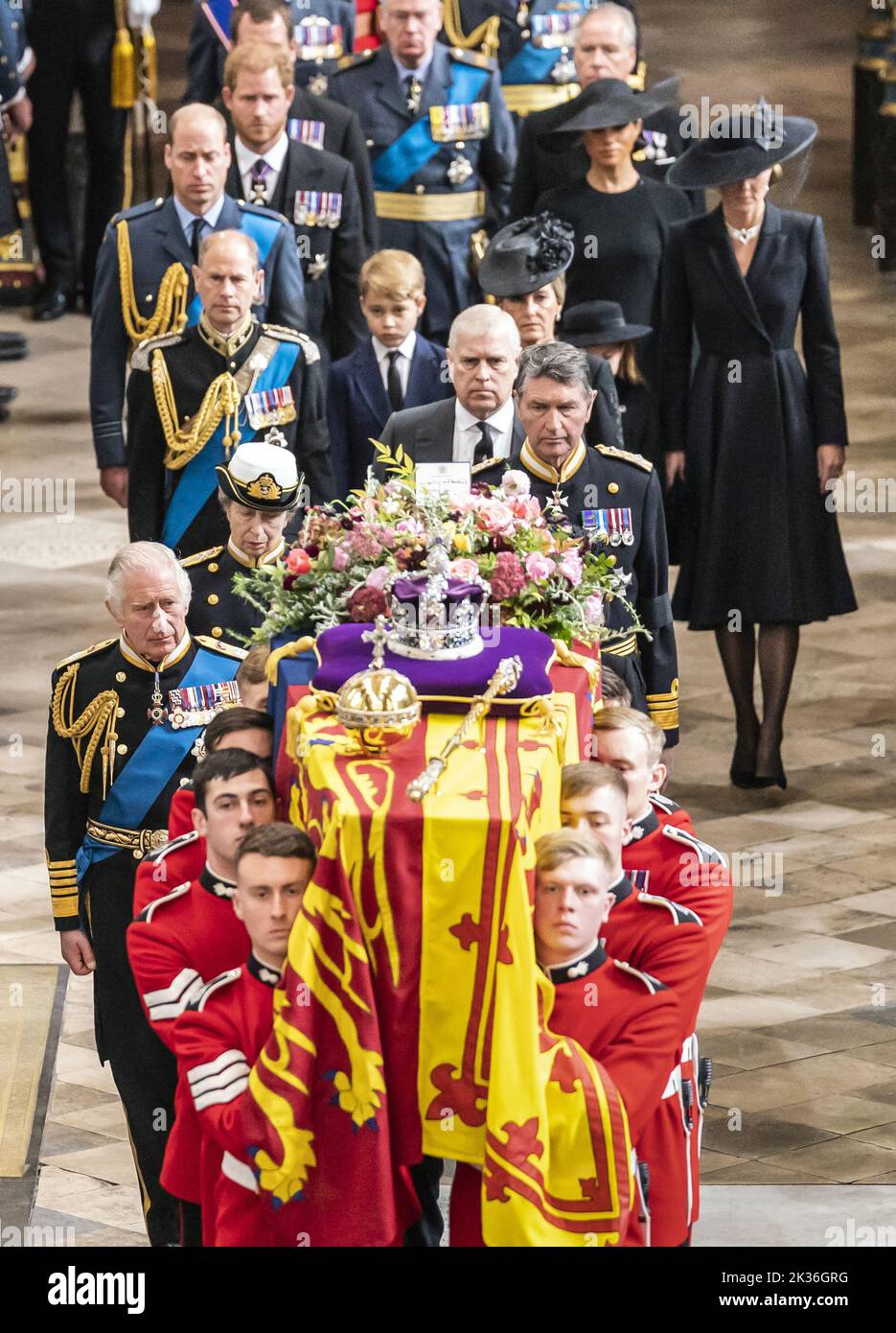 King Charles III, the Queen Consort, the Princess Royal, Vice Admiral Sir Tim Laurence, the Duke of York, the Earl of Wessex, the Countess of Wessex, the Prince and Princess of Wales, Prince George, Princess Charlotte, the Duke and Duchess of Sussex, Peter Phillips (obscured) and the Earl of Snowdon (rear right) follow behind the coffin of Queen Elizabeth II, draped in the Royal Standard with the Imperial State Crown and the Sovereign's orb and sceptre, as it is carried out of Westminster Abbey after her State Funeral. Picture date: Monday September 19, 2022. See PA story FUNERAL Queen. Photo  Stock Photo