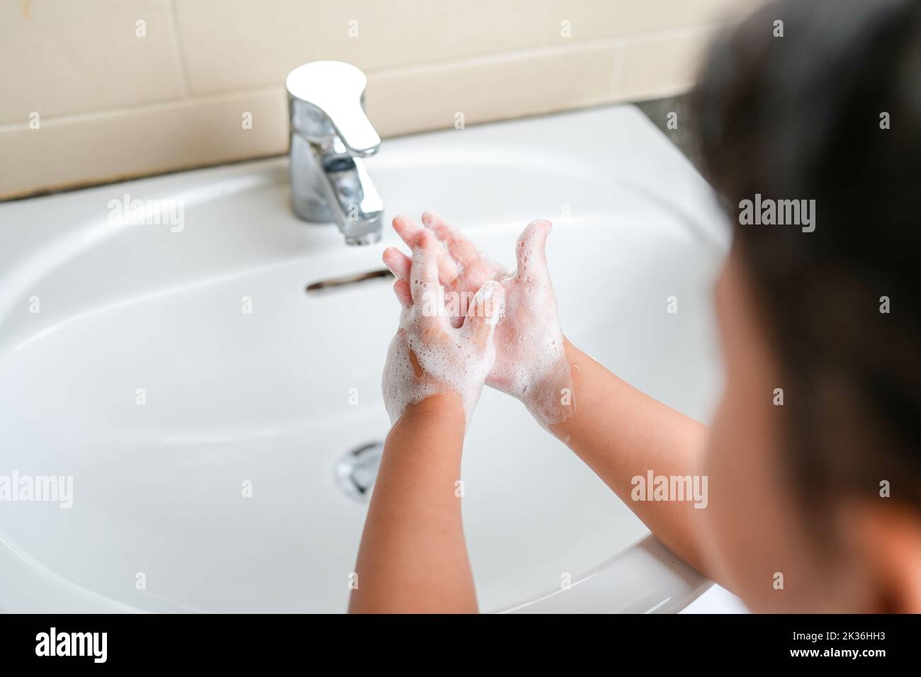 A child washing the hands with soap Stock Photo - Alamy