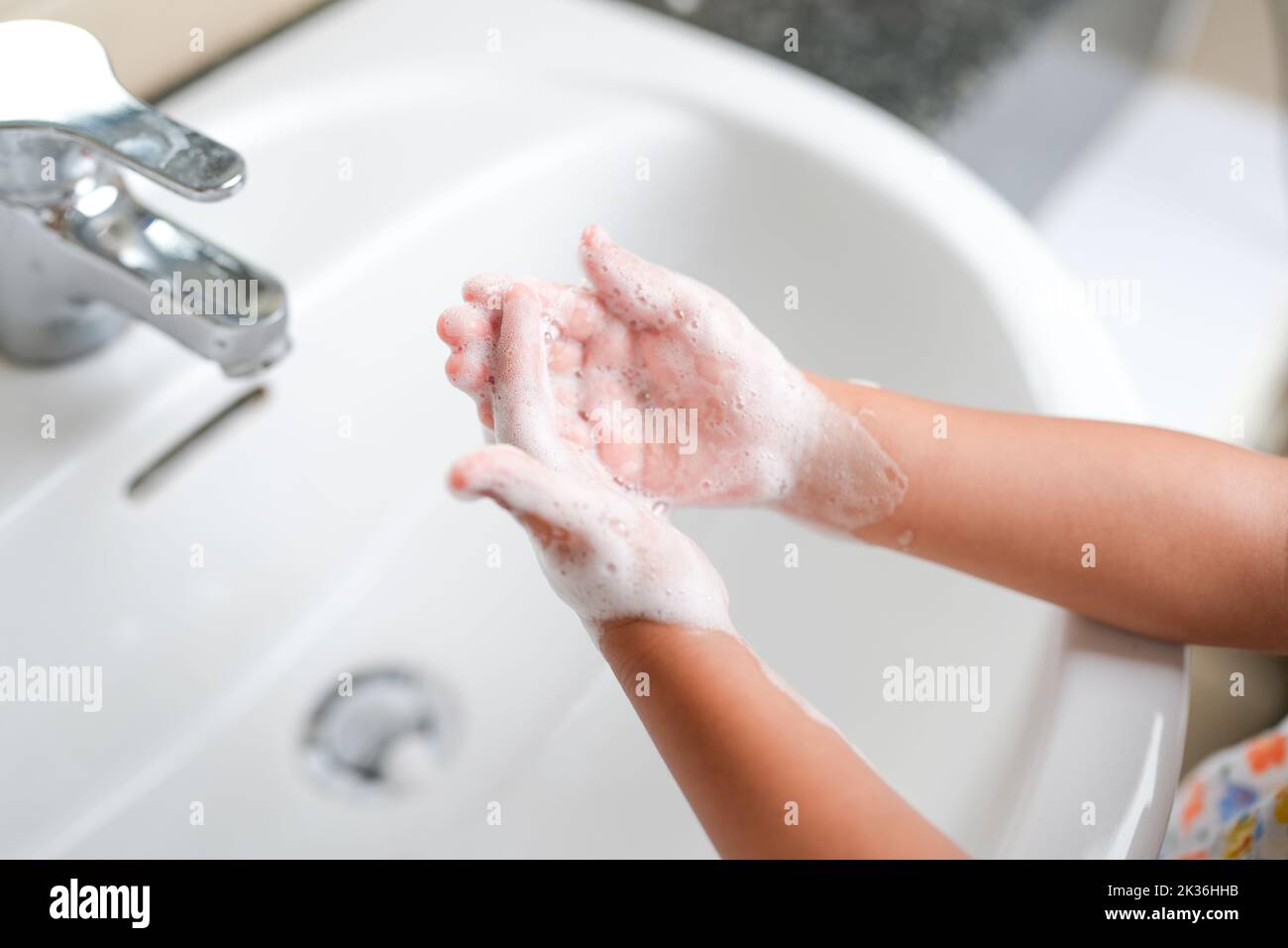 Child washing hands soap hi-res stock photography and images - Alamy