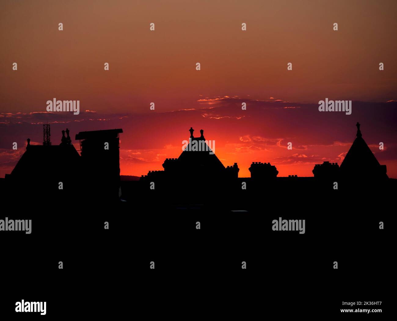 Sunset through the roofs of sibiu in transylvania Stock Photo