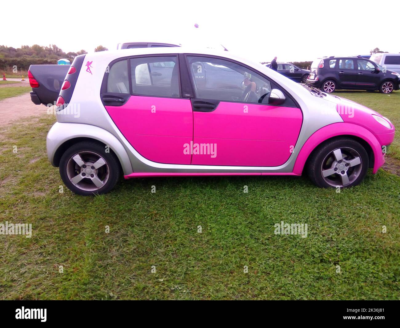 Smart car Forfour 1.3 litre in candy pink with copy space Stock Photo