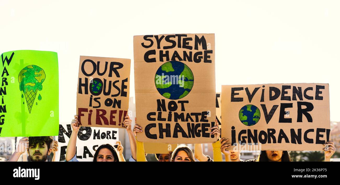 Group of activists protesting for climate crisis - Global warming concept Stock Photo