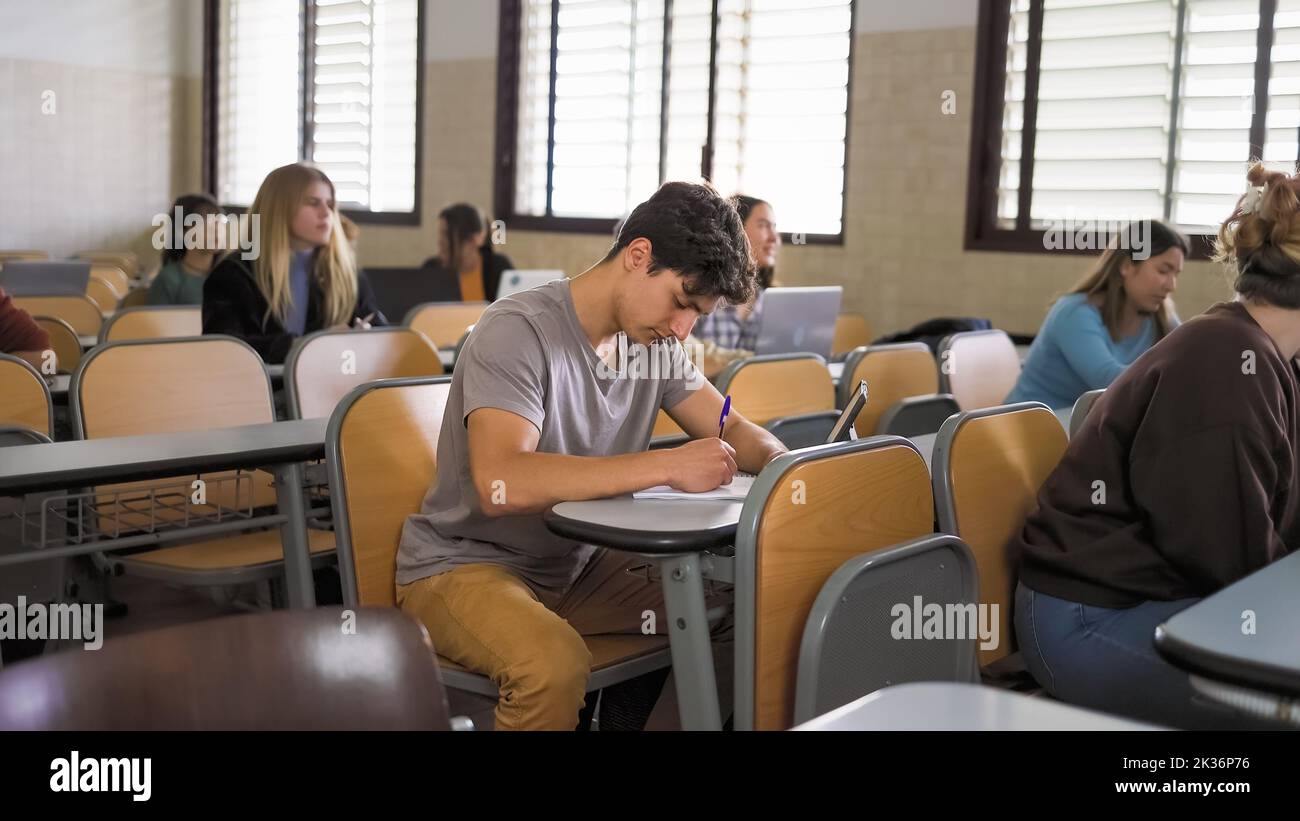 Young people studying inside university classroom - School education concept Stock Photo