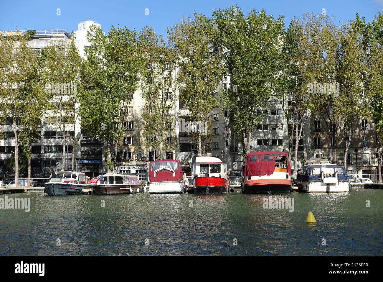 Ships moored on the Canal de l'Ourcq, in Paris, have become permanent accommodation Stock Photo