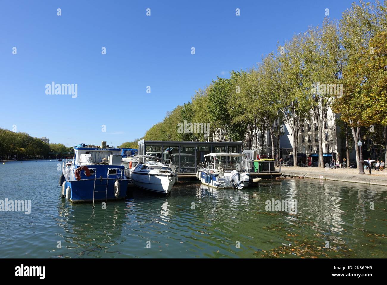 Ships moored on the Canal de l'Ourcq, in Paris, have become permanent accommodation Stock Photo