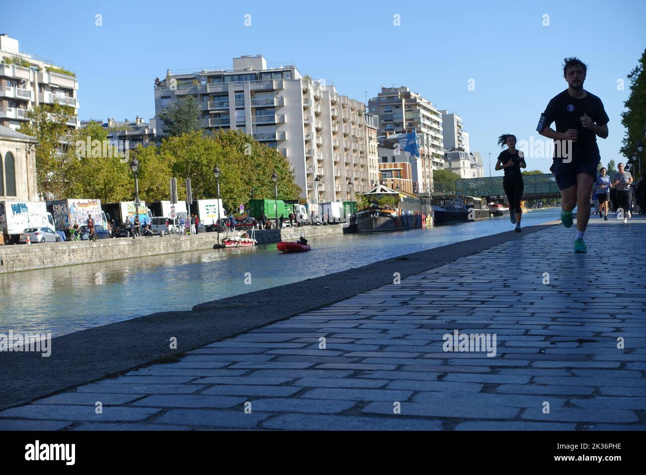 Parisians run on Sundays on the banks of the Canal de l'Ourcq, in Paris Stock Photo