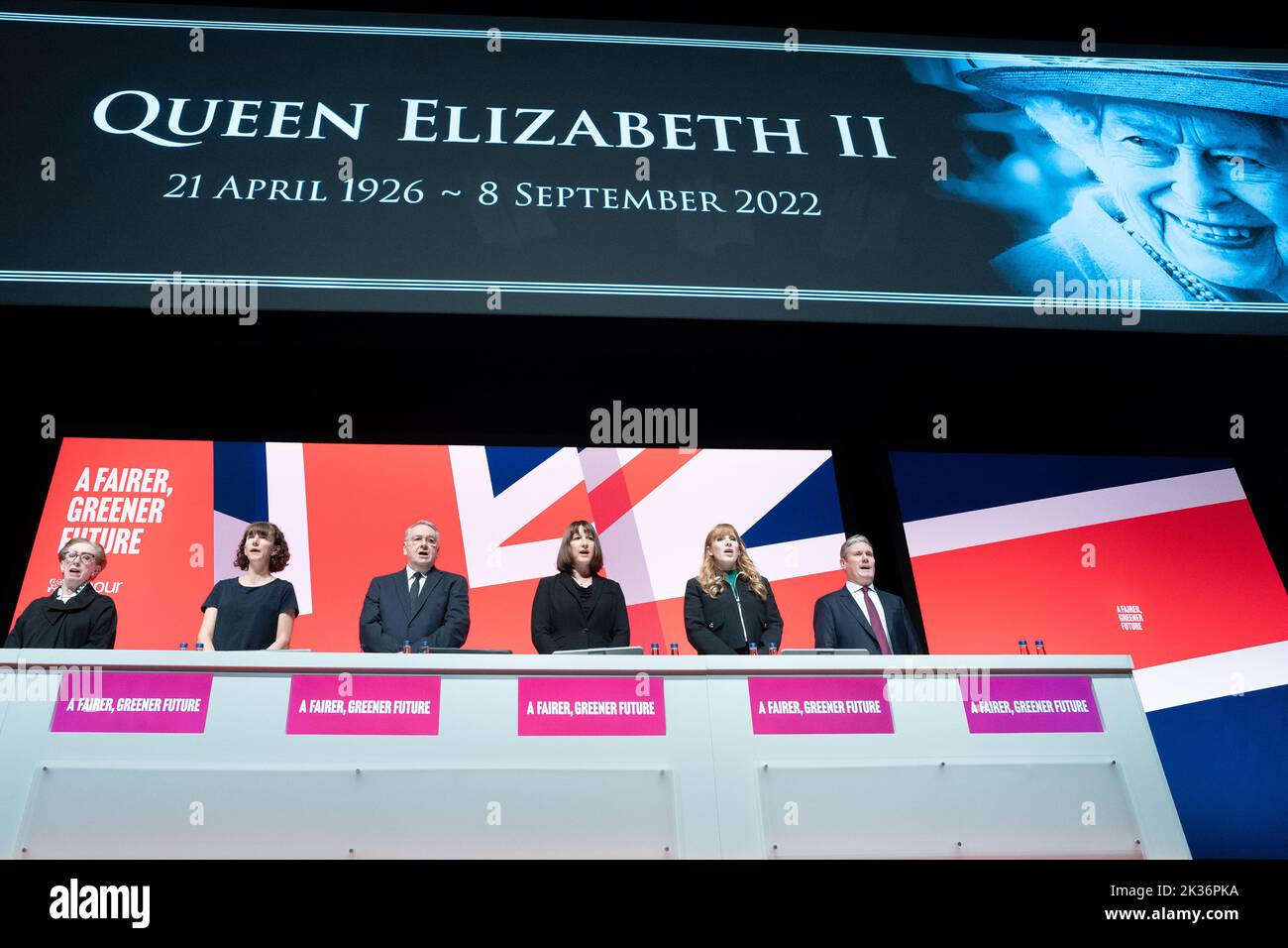 Labour party leader Sir Keir Starmer (right) leads tributes to Queen Elizabeth II as the national anthem is sung during the Labour Party Conference in Liverpool. Picture date: Sunday September 25, 2022. Stock Photo