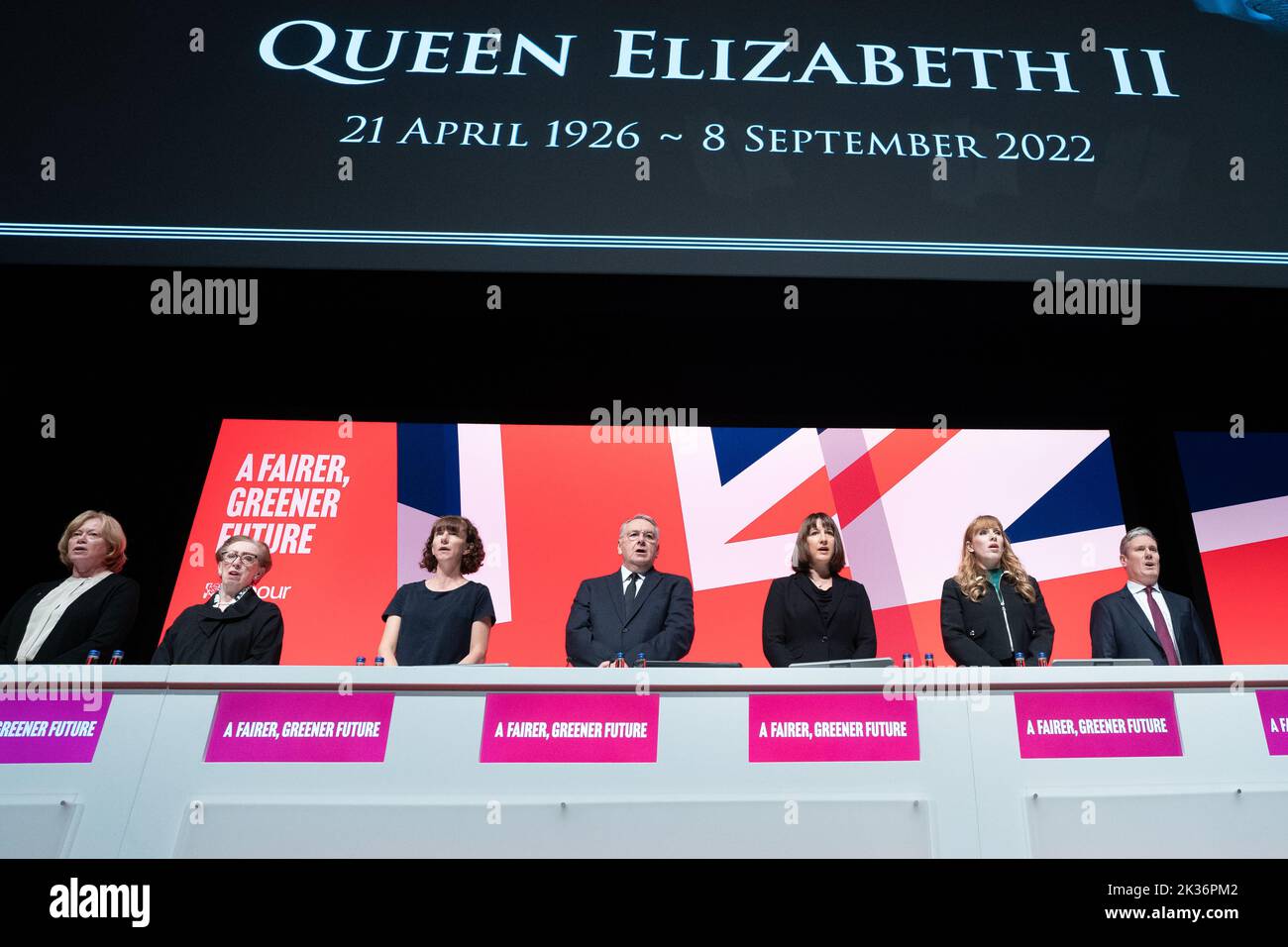 Labour party leader Sir Keir Starmer (right) leads tributes to Queen Elizabeth II as the national anthem is sung during the Labour Party Conference in Liverpool. Picture date: Sunday September 25, 2022. Stock Photo