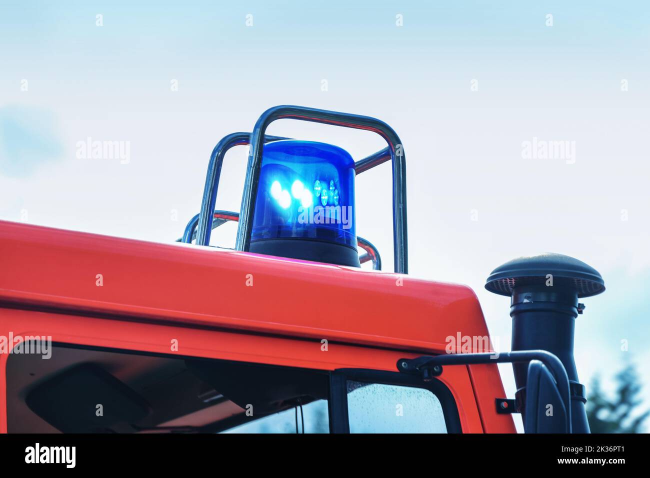 Flashing blue light on a fire truck in duty, part of the vehicle, copy